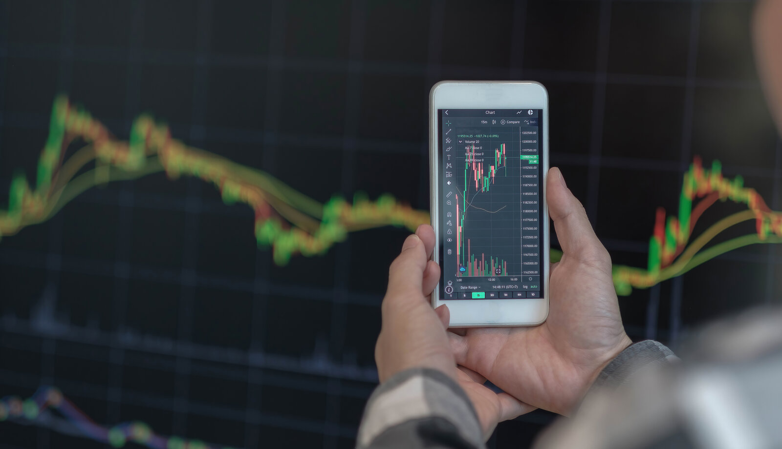 Trading crypto on Coinbase Person using a mobile phone to trade cryptocurrency on an exchange