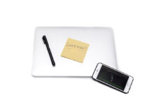 Laptop and smartphone with finance app, representing MoneyLion mobile banking