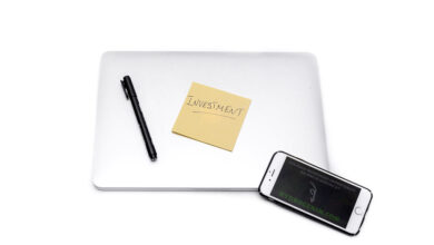 Laptop and smartphone with finance app, representing MoneyLion mobile banking