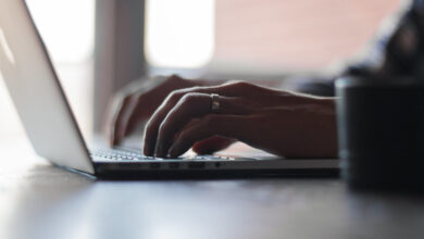 Hands typing on a laptop, online shopping with Rakuten