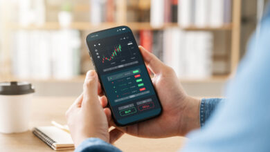 Person using the Robinhood investing app on a phone to claim a free stock referral bonus