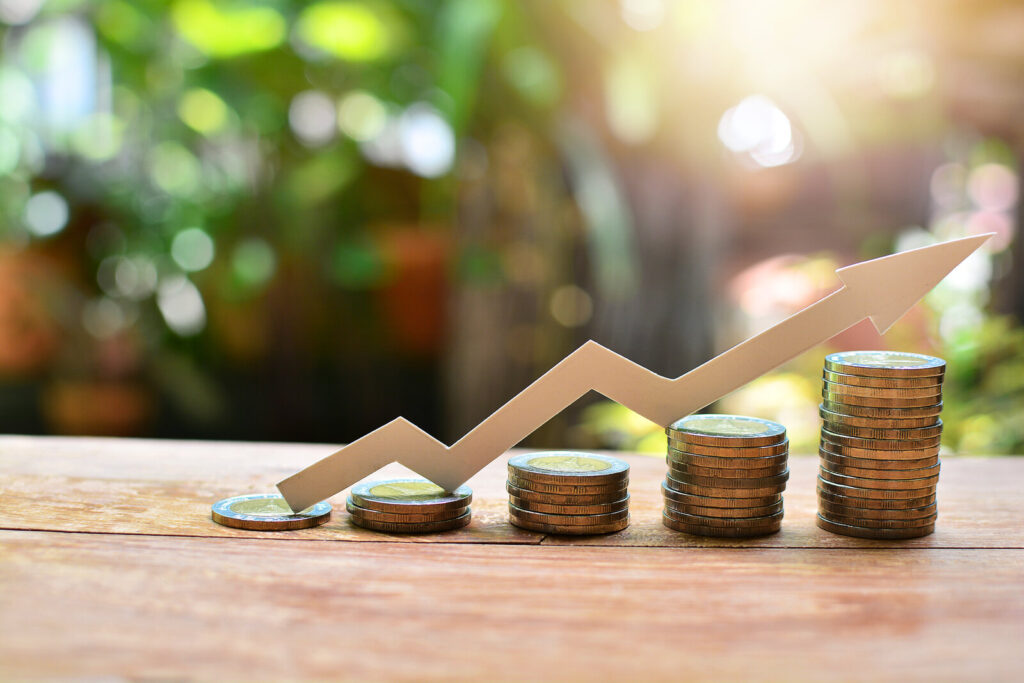 Coins with a growing plant representing SoFi savings APY