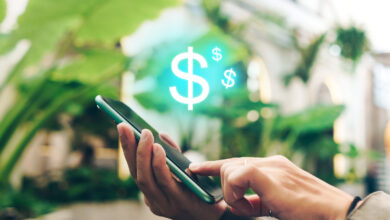 Person making a mobile payment illustrating the SoFi referral bonus